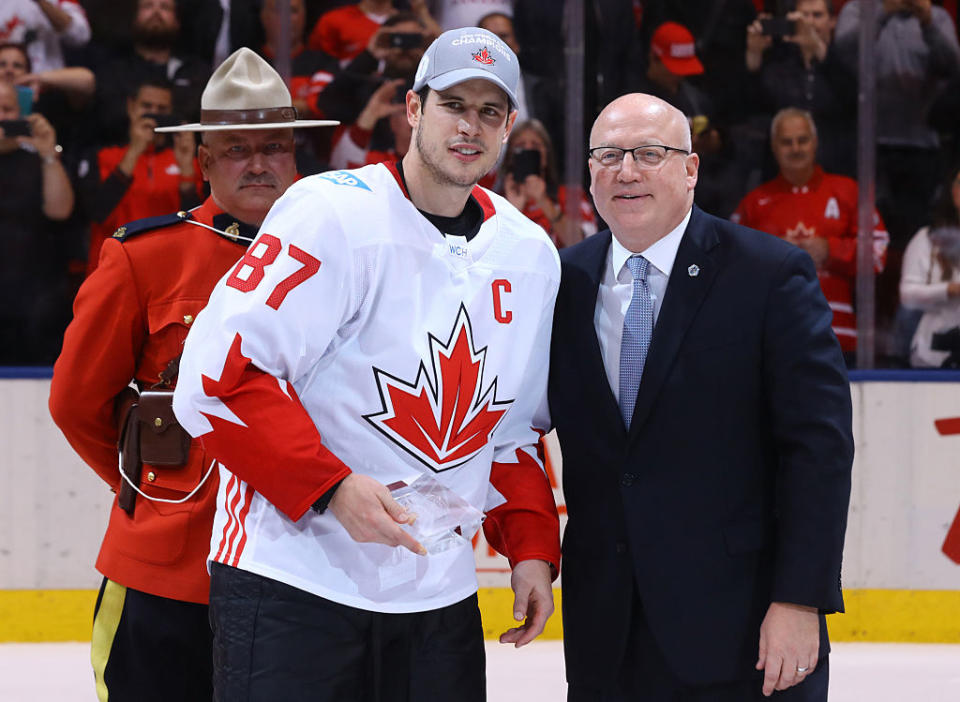 TORONTO, ON - SEPTEMBER 29: Bill Daly presents Sidney Crosby #87 of Team Canada with the World Cup of Hockey Championship MVP trophy after his teams win over Team Europe during Game Two of the World Cup of Hockey final series at the Air Canada Centre on September 29, 2016 in Toronto, Canada. The Team Canada defeated Team Europe 2-1. (Photo by Bruce Bennett/Getty Images)