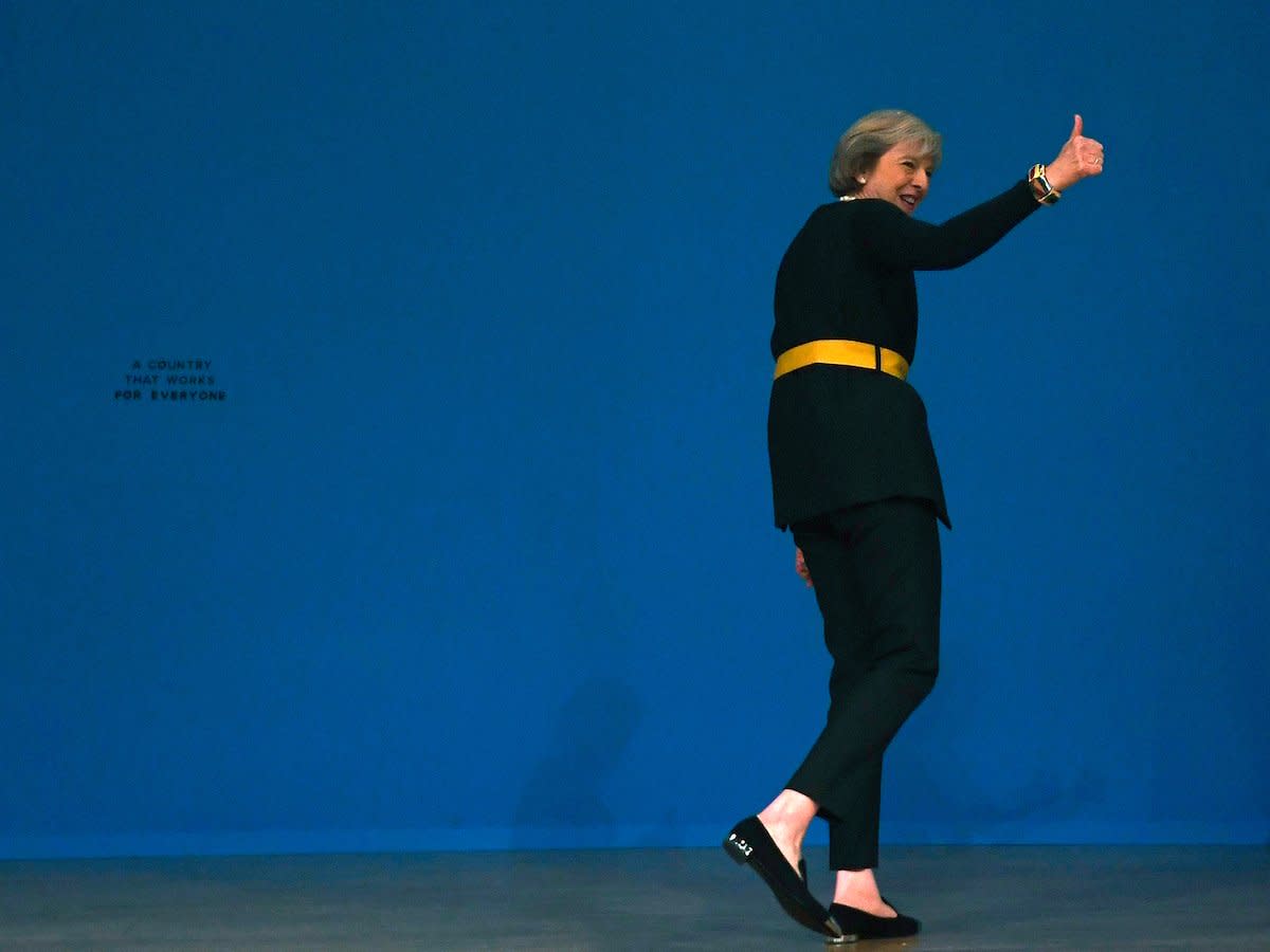 Britain's Prime Minister Theresa May's walks off stage after speaking at the annual Conservative Party Conference in Birmingham, Britain, October 2, 2016.