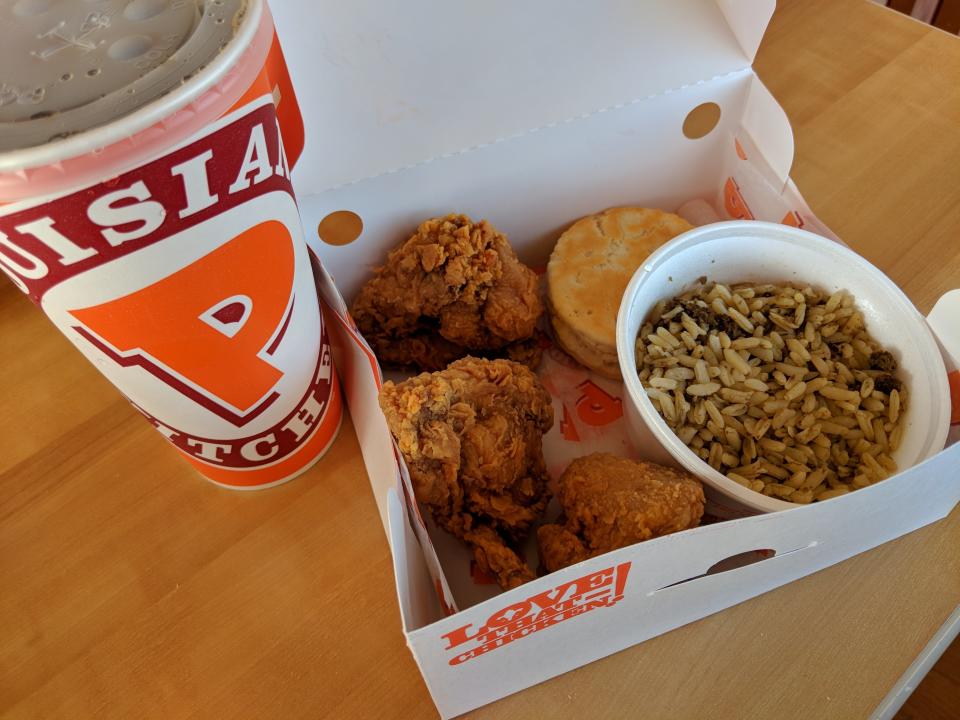 Trust me, I&rsquo;m as surprised as you that Popeye&rsquo;s didn&rsquo;t fare so well. It&rsquo;s a beloved chain (even <a href="https://firstwefeast.com/eat/2016/01/chefs-love-popeyes" target="_blank">beloved by respected chefs</a>) born and raised in Louisiana that grew so popular <a href="http://money.cnn.com/2017/02/21/investing/restaurant-brands-burger-king-popeyes-acquisition/index.html" target="_blank">it got snapped up</a> by the company that owns Burger King. <br /><br />Their following is due, in part, to their spicy chicken. And&nbsp;because of the completely arbitrary rules I&nbsp;set for this ranking, I couldn&rsquo;t order the spicy chicken, because that&rsquo;d be unfair to the other non-spicy chicken from everywhere else. It&rsquo;s like comparing fried apples to fried oranges! I judged all the fried chicken on the &ldquo;fried&rdquo; and the &ldquo;chicken&rdquo; parts. And Popeye&rsquo;s really let me down.<br /><br />I ordered a two-piece with wings and was served... three wings.&nbsp;I wasn't complaining about the extra wing.&nbsp;I also ordered a soda with a side of cajun rice because as the saying goes, "When in Popeye's!"&nbsp;<br /><br />While the meat was well-seasoned, the chicken was barely warm. Even if it came directly out of the fryer and was served hot, I don&rsquo;t think it would take higher than fifth place in this ranking. The chicken was uninviting and dry. But that buttery biscuit? I&rsquo;d eat it a million times. Can they make biscuits in the shape of fried chicken?! I&rsquo;d come back for that.