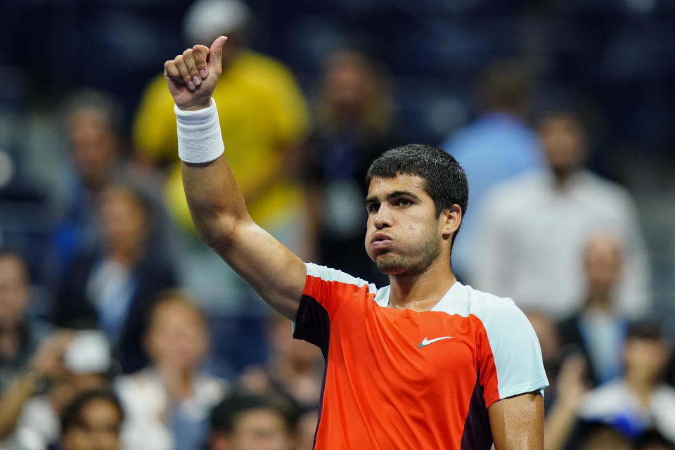 Carlos Alcaraz, of Spain, waves to the crowd after beating Jannik Sinner, of Italy, during the quarterfinals of the U.S. Open tennis championships, early Thursday, Sept. 8, 2022, in New York. (AP Photo/Frank Franklin II)