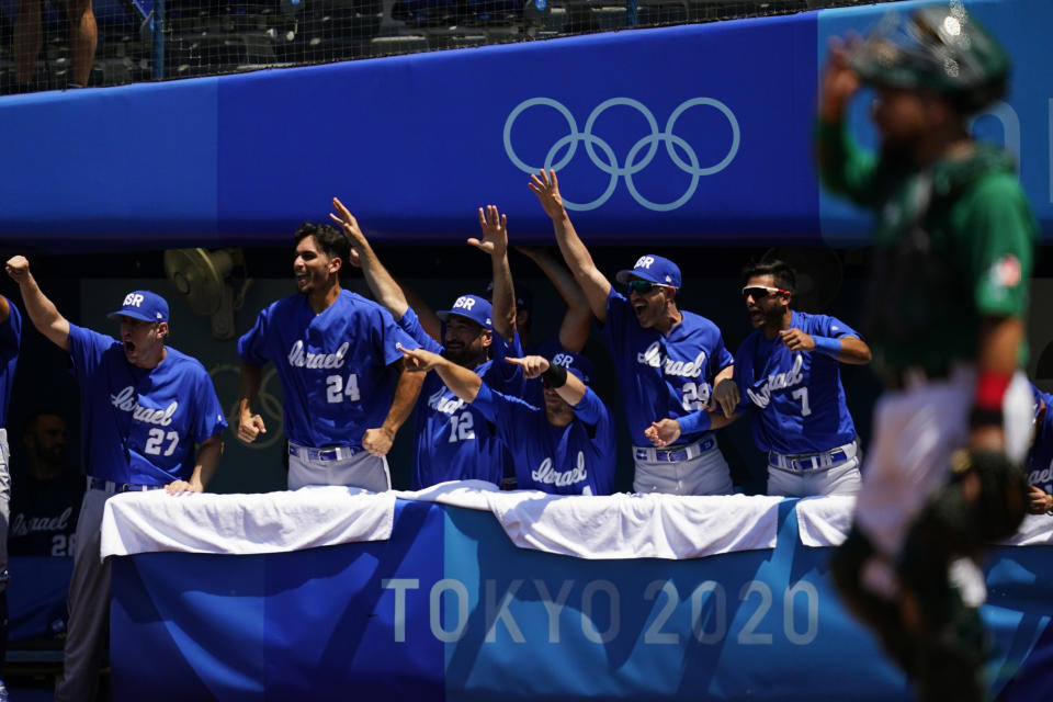 Israel players react after Danny Valencia hit a three-run home run by during a baseball game against Mexico at Yokohama Baseball Stadium during the 2020 Summer Olympics, Sunday, Aug. 1, 2021, in Yokohama, Japan. (AP Photo/Matt Slocum)