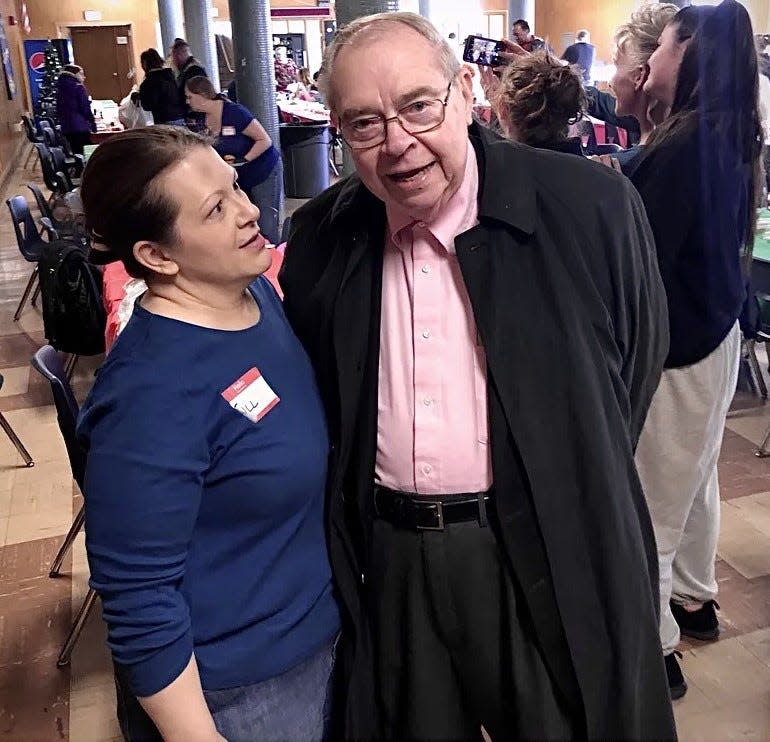 The late Gerald Croteau, right, is seen here in 2019 with volunteer Jill Lagace in the basement of the former Coyle and Cassidy High and Middle School during the annual Corline Cronan’s Family Christmas Day turkey dinner.