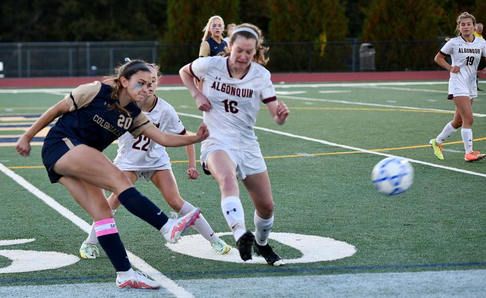 Shrewsbury's Calista Vlahos fires a pass past Algonquin's Katie Cullen.