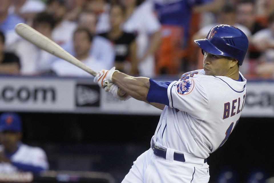 FILE - In this Wednesday, June 11, 2008 file photo, New York Mets' Carlos Beltran follows through on a line-drive single to center field that scored Jose Reyes and Luis Castillo during the fourth inning against the Arizona Diamondbacks in a baseball game at Shea Stadium in New York. A person familiar with the decision tells The Associated Press the New York Mets have decided to hire Carlos Beltrán as their manager. The person spoke on condition of anonymity Friday, Nov. 1, 2019 because the team has not made an announcement. (AP Photo/Julie Jacobson, File)