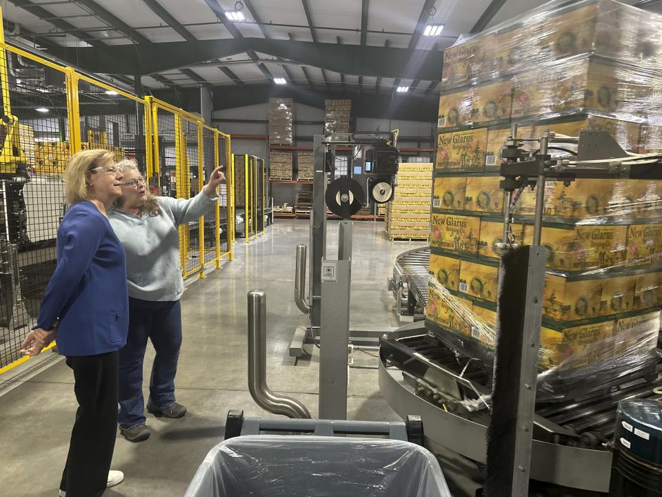 Wisconsin Democratic U.S. Sen. Tammy Baldwin talks to New Glarus Brewing Company co-owner Deb Carey during a campaign stop, Thursday, March 28, 2024, in New Glarus, Wis. The stop was part of her campaign launch tour in a race against Republican Eric Hovde the could determine who has majority control of the Senate. The Wisconsin Senate race between Democratic Sen. Tammy Baldwin and Republican Eric Hovde is setting up as one of the most competitive and expensive Senate races in the country. (AP Photo/Scott Bauer)