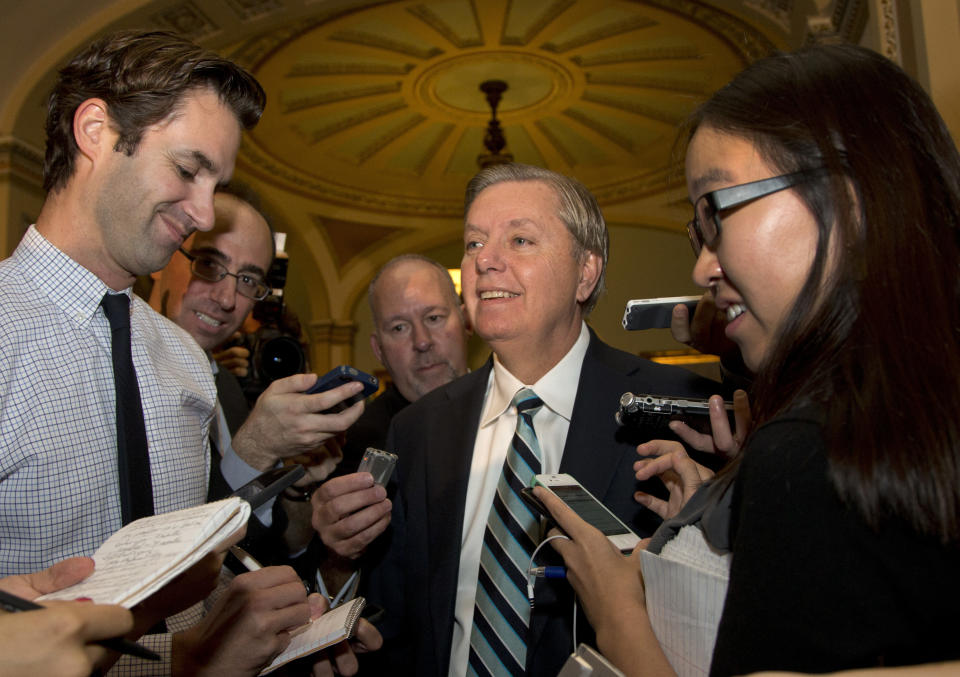 Sen. Lindsey Graham, R-S.C., speaks with reporters on Capitol Hill, Wednesday, Oct. 16, 2013, in Washington. Time is growing short for Congress to prevent a threatened Treasury default and stop a partial government shutdown. (AP Photo/Carolyn Kaster)