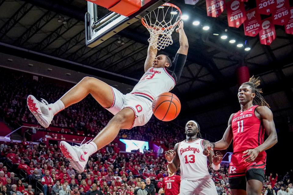 Ohio State's Zed Key (23) dunks as Rutgers' Clifford Omoruyi (11) looks on in the first half of an NCAA college basketball game, Sunday, Jan. 15, 2023, in Piscataway, N.J. (AP Photo/John Minchillo)