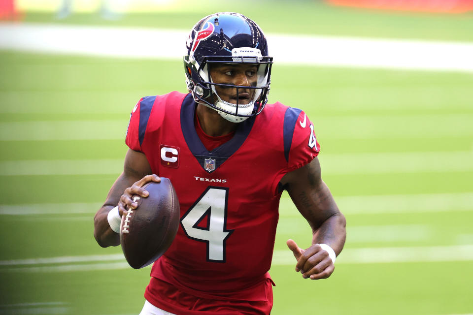 HOUSTON, TEXAS - DECEMBER 06:  Deshaun Watson #4 of the Houston Texans scrambles with the ball against the Indianapolis Colts during the first half at NRG Stadium on December 06, 2020 in Houston, Texas. (Photo by Carmen Mandato/Getty Images)