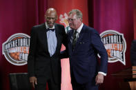 Inductee Jack Sikma, right, stands with presenter Kareem Abdul-Jabbar at the Basketball Hall of Fame enshrinement ceremony Friday, Sept. 6, 2019, in Springfield, Mass. (AP Photo/Elise Amendola)