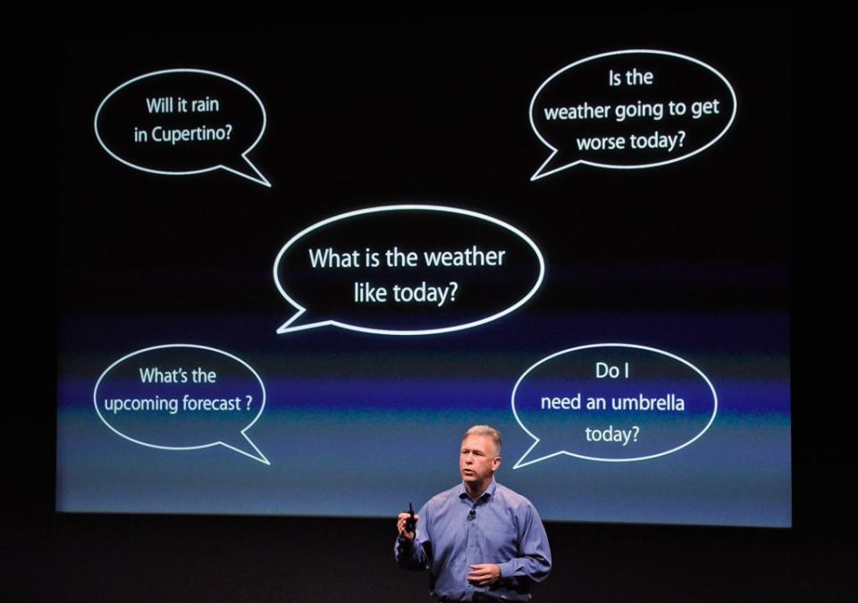 CUPERTINO, CA - OCTOBER 04: Apple's Senior Vice President of Worldwide product marketing Phil Schiller standing in front of an image showing thought bubbles discusses the new personal assistant called Siri for the new iPhone 4s at the company's headquarters October 4, 2011 in Cupertino, California. The announcement marks the first time new CEO Tim Cook introduced a new product since Apple co-founder Steve Jobs resigned in August. (Photo by Kevork Djansezian/Getty Images)