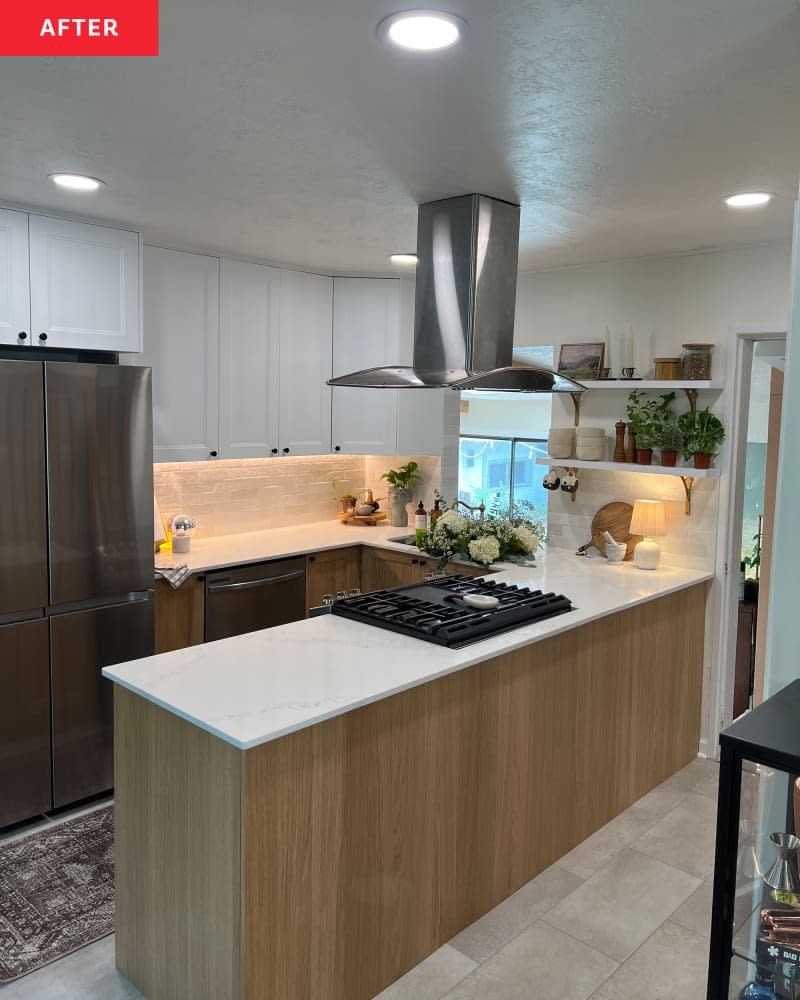 white kitchen with white brick tile backsplash, wood island, and white marble countertops after remodel