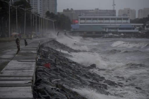 Strong waves, whipped up by powerful winds, pound have pounded Manila's waterfront