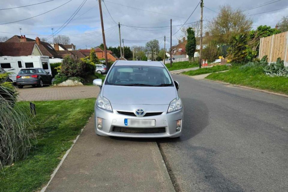 Gazette: One of the cars parked on the pavement near Louise's home