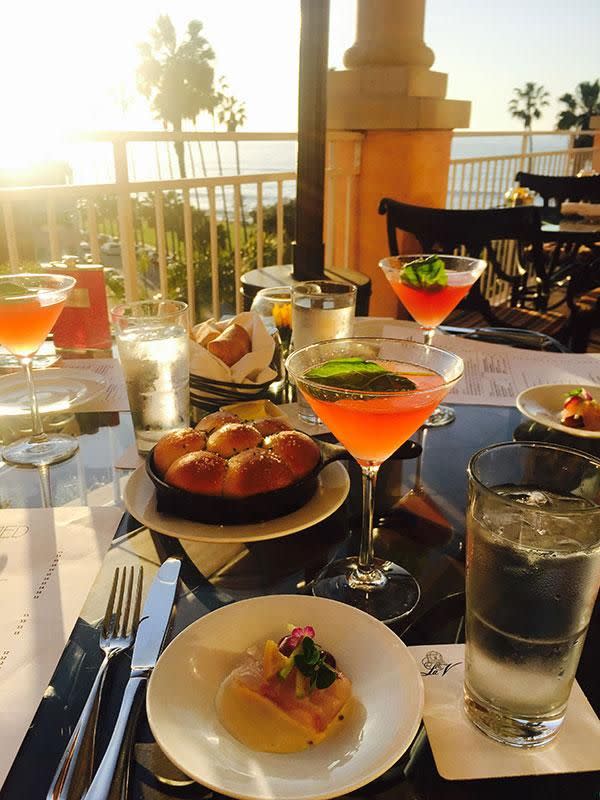 The signature Pink Lady cocktail with Big Eye Tuna Tartar and Hokkaido Scallop Carpaccio to start. Photo: Be