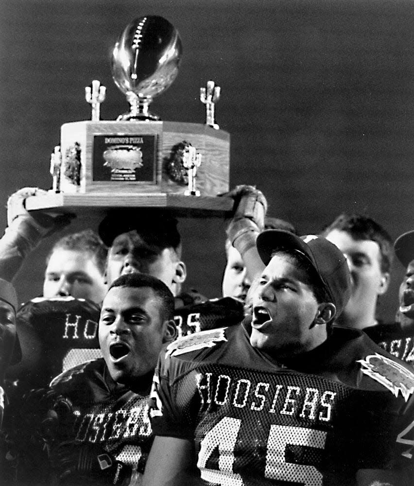 Indiana football fans celebrate with the Copper Bowl trophy after defeating Baylor in the 1991 bowl game.