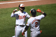 Baltimore Orioles' Ryan McKenna, left, celebrates his home run with Gunnar Henderson, right, during the fourth inning of a baseball game against the New York Yankees, Thursday, May 2, 2024, in Baltimore. (AP Photo/Nick Wass)