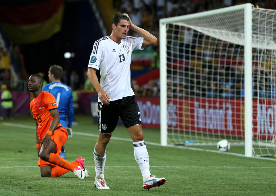 KHARKOV, UKRAINE - JUNE 13: Mario Gomez of Germany celebrates scoring their second goal during the UEFA EURO 2012 group B match between Netherlands and Germany at Metalist Stadium on June 13, 2012 in Kharkov, Ukraine. (Photo by Ian Walton/Getty Images)