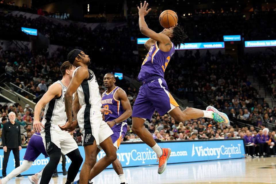 Phoenix Suns guard Saben Lee (30) shoots over San Antonio Spurs guard Blake Wesley (14) during the first half at AT&T Center on Jan. 28, 2023, in San Antonio.