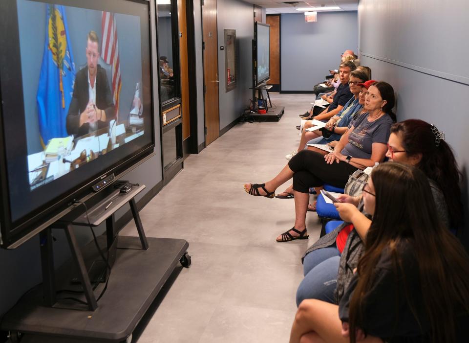 Monitors are in the hall for the overflow crowd Thursday during the Oklahoma State Board of Education. Most of the people in the seats were waiting to speak during the public comments.