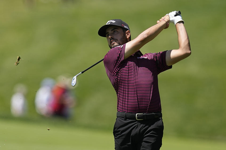 Abraham Ancer, of Mexico, hits from the first fairway during the final round of the Memorial golf tournament Sunday, June 5, 2022, in Dublin, Ohio. (AP Photo/Darron Cummings)