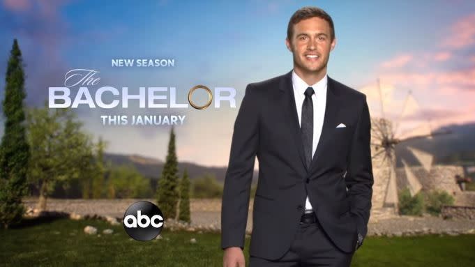 Peter Weber stands in a promo in front of a windmill with the words "New Season The Bachelor This January"