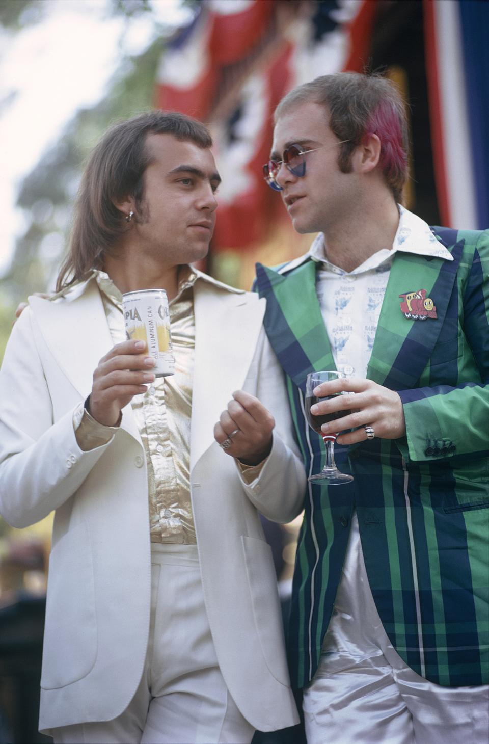 UNIVERSAL CITY, CA – JULY 10: Pop singer Elton John and songwriter Bernie Taupin attend a private party at Universal Studios on July 10, 1973 in Universal City, California. (Photo by Ed Caraeff/Getty Images)