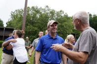 FILE - Kentucky Governor Andy Beshear, center, talks with residents that have been displaced by floodwaters at Jenny Wiley State Resort Park on Aug. 6, 2022, in Prestonsburg, Ky. (AP Photo/Brynn Anderson, File)