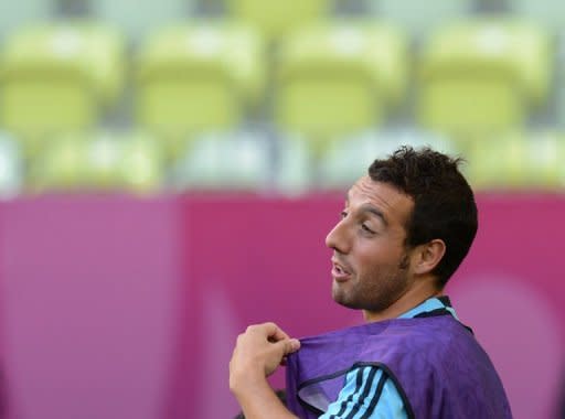 Arsenal manager Arsene Wenger denied he was close to signing Spain's Santi Cazorla, pictured in June 2012, as the English football giants kicked off an Asian tour Tuesday with a narrow 2-1 victory over hosts Malaysia