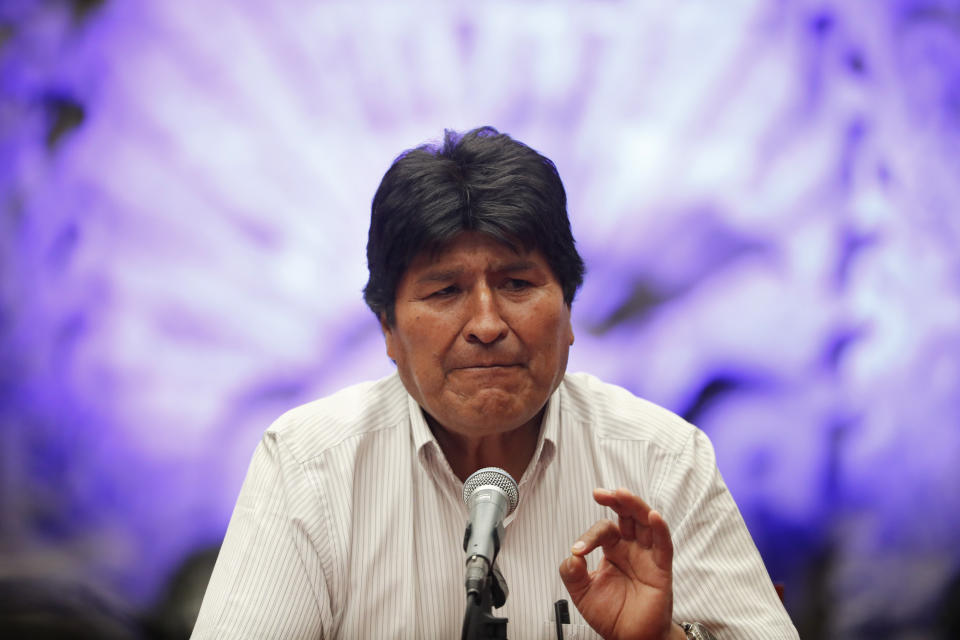 Bolivia's former President Evo Morales speaks during a press conference at the Museum of Mexico City, Wednesday, Nov. 13, 2019. Mexico has granted asylum to Morales, who resigned on Nov. 10th under mounting pressure from the military and the public after his re-election victory triggered weeks of fraud allegations and deadly protests. (AP Photo/Marco Ugarte)