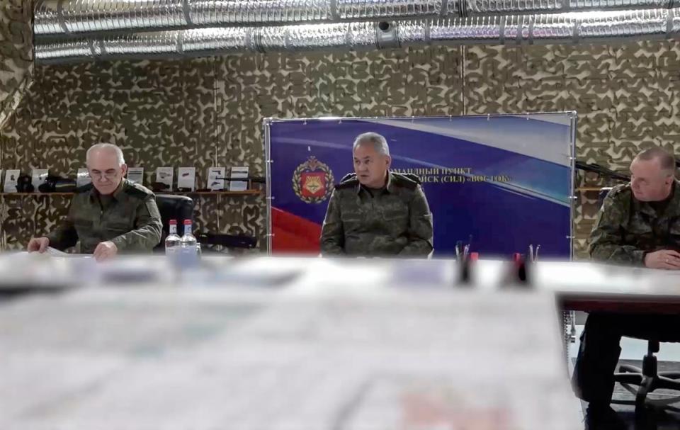 Russian defence minister Sergei Shoigu (centre) inspecting the forward command post of the ‘Vostok’ (East) group of troops at an undisclosed location in Ukraine (EPA)