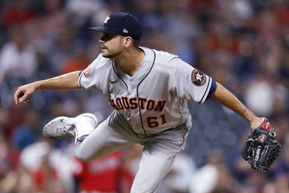 Houston Astros relief pitcher Seth Martinez watches a throw to a Cleveland Guardians batter during the eighth inning of a baseball game Friday, Aug. 5, 2022, in Cleveland. (AP Photo/Ron Schwane)