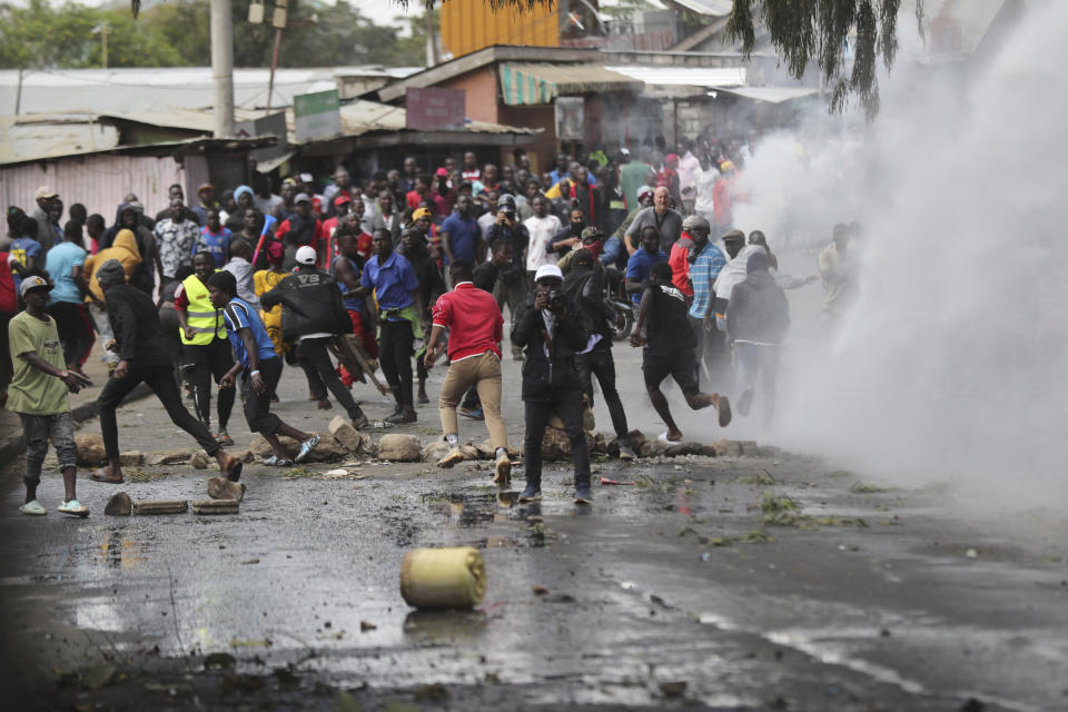 Police clash with protesters during a protest by supporters of Kenya's opposition leader Raila Odinga over the high cost of living and alleged stolen presidential vote, in Nairobi, Monday, March 20, 2023. (AP Photo/Brian Inganga)