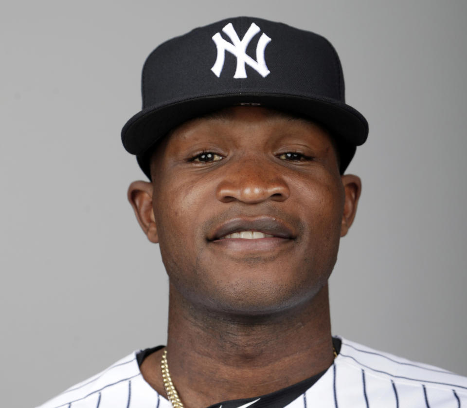 FILE - This is a 2019 photo of Domingo German of the New York Yankees baseball team. Yankees pitcher Domingo German will miss the first 63 games of the 2020 season as part of an 81-game ban for violating Major League Baseball’s domestic violence policy. The league announced the suspension Thursday, Jan. 2, 2020. German has agreed not to appeal. (AP Photo/Lynne Sladky, File)