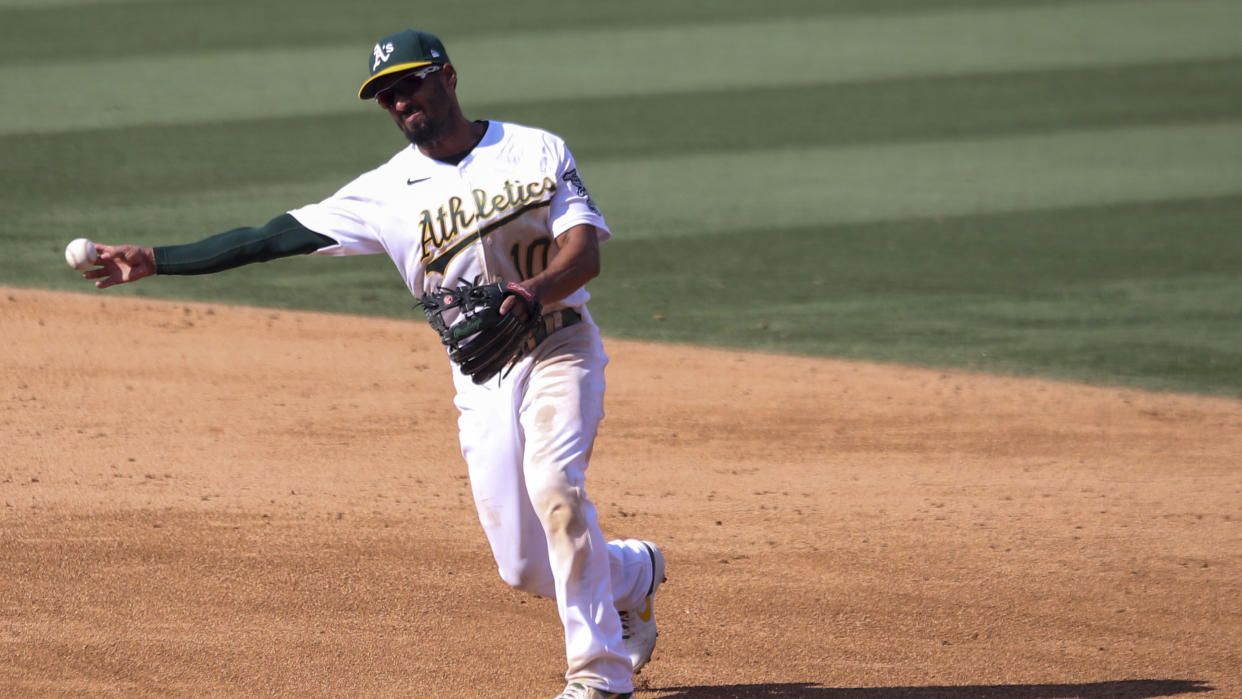 LOS ANGELES, CA - OCTOBER 05: Marcus Semien #10 of the Oakland Athletics throws to first during Game 1 of the ALDS between the Houston Astros and the Oakland Athletics at Dodger Stadium on Monday, October 5, 2020 in Los Angeles, California. (Photo by Rob Leiter/MLB Photos via Getty Images)