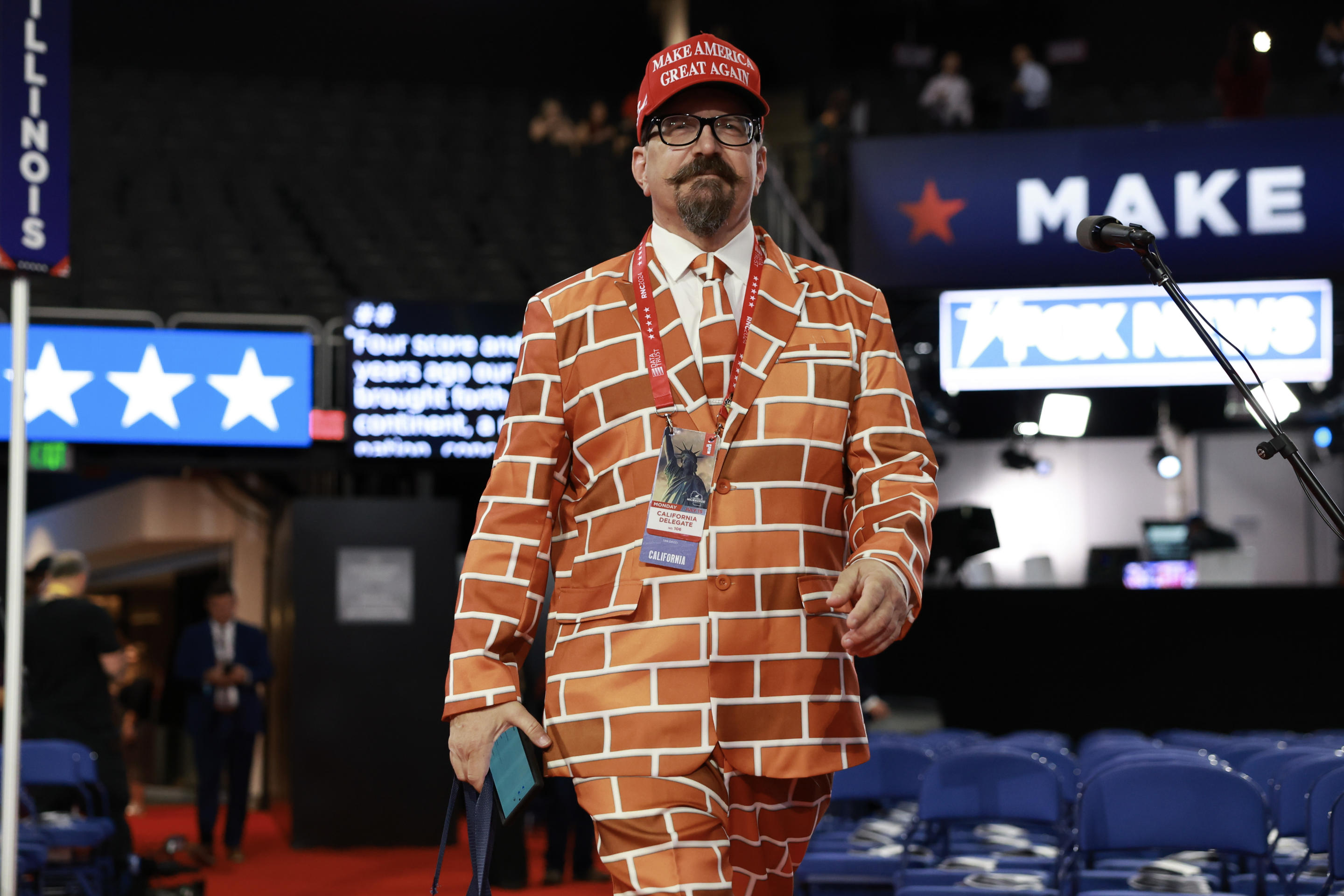 Blake Marnell wears his brick suit before the start of the first day of the Republican National Convention.