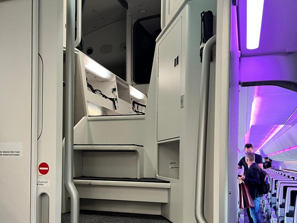 A closer view of the narrow staircase leading up to the Airbus A350's crew rest area.