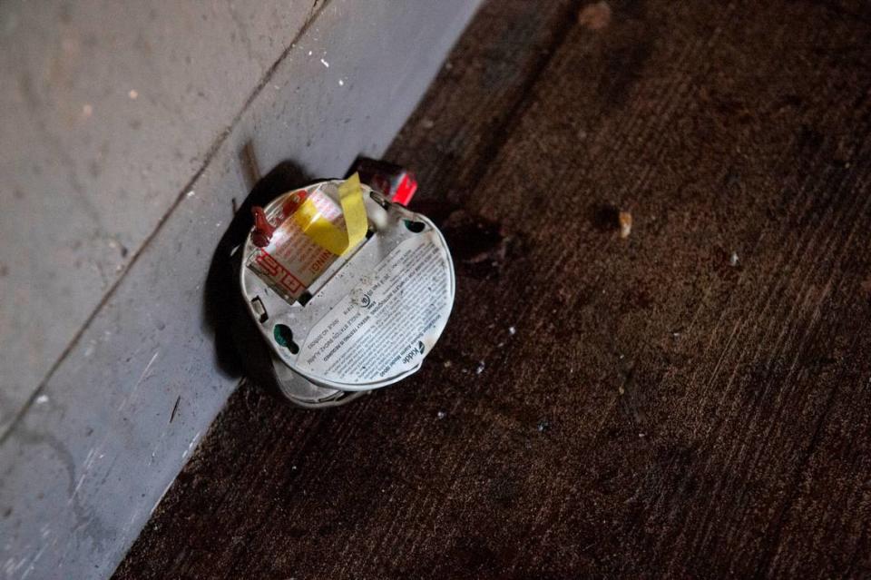 A burnt smoke detector in the stairwell of the I building of the William Bell Apartments in Gulfport where a fire killed two and injured 5, two of them critically, in the early hours of Wednesday, Jan. 25, 2023.