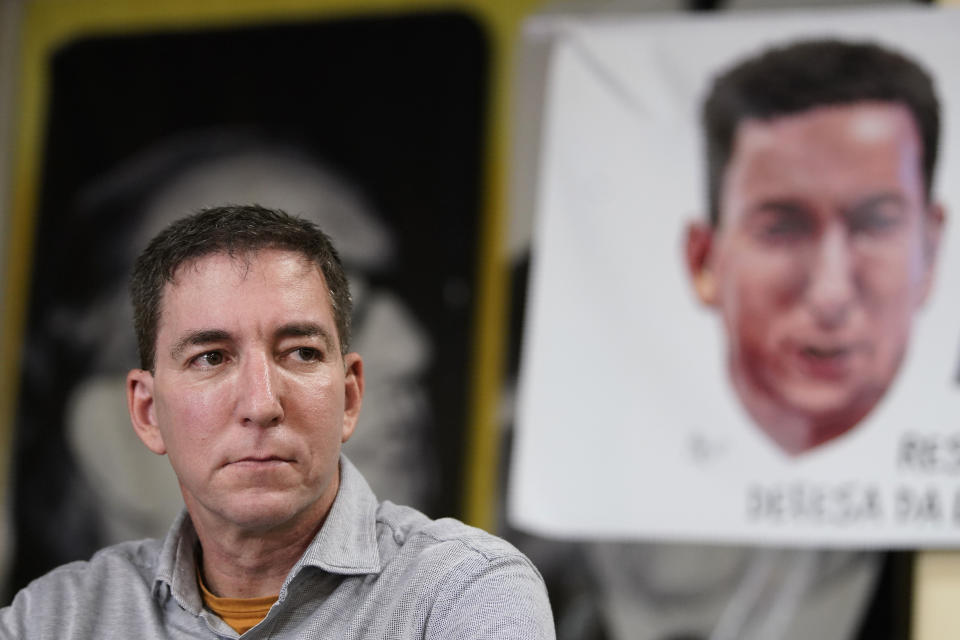 Journalist Glenn Greenwald listens to a question during a press conference before the start of a protest in his support in front of the headquarters of the Brazilian Press Association, known as ABI, in the city of Rio de Janeiro, Brazil, Tuesday, July 30 , 2019. Brazil's president has raised the possibility of jail for journalist Glenn Greenwald a few days after members of his party said the American's Brazil-based internet publication was "aligned with criminal hackers" for reporting on hacked phone calls. (AP Photo/Ricardo Borges)