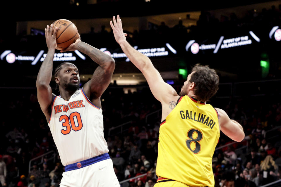 New York Knicks forward Julius Randle (30) puts up a shot over Atlanta Hawks forward Danilo Gallinari (8) during the second half of an NBA basketball game Saturday, Jan. 15, 2022, in Atlanta. (AP Photo/Butch Dill)