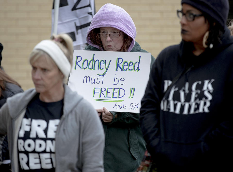 A woman holds a sign during a protest against the execution of Rodney Reed on Wednesday, Nov. 13, 2019, in Bastrop, Texas. Protesters rallied in support of Reed’s campaign to stop his scheduled Nov. 20 execution for the 1996 killing of a 19-year-old Stacy Stites. New evidence in the case has led a growing number of Texas legislators, religious leaders and celebrities to press Gov. Greg Abbott to intervene. (Nick Wagner/Austin American-Statesman via AP)