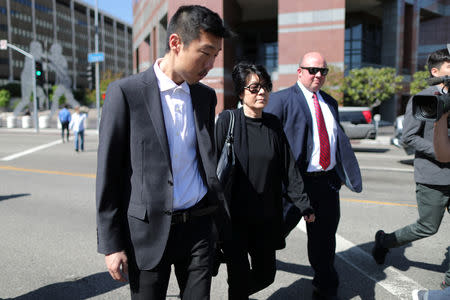 The mother (C) of Christopher Ahn, the former US Marine who is a suspect in the raid by a dissident group on the North Korean Embassy in Madrid, walks out of federal court in Los Angeles after a detention hearing, California, U.S., April 23, 2019. REUTERS/Lucy Nicholson