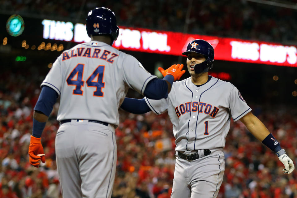 WASHINGTON, DC - OCTOBER 27:  Carlos Correa #1 of the Houston Astros is greeted by teammate Yordan Alvarez #44 after hitting a two-run home run in the fourth inning during Game 5 of the 2019 World Series between the Houston Astros and the Washington Nationals at Nationals Park on Sunday, October 27, 2019 in Washington, District of Columbia. (Photo by Alex Trautwig/MLB Photos via Getty Images)