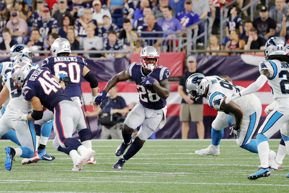 FOXBOROUGH, MA - AUGUST 22: New England Patriots running back Sony Michel (26) looks to break through the hole in the line during a preseason game between the New England Patriots and the Carolina Panthers on August 22, 2019, at Gillette Stadium in Foxborough, Massachusetts. (Photo by Fred Kfoury III/Icon Sportswire via Getty Images)
