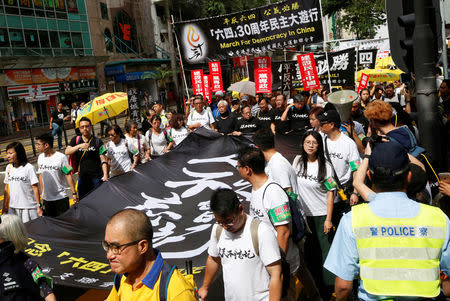 Protesters take part in a march ahead of June 4 anniversary of military crackdown on pro-democracy protesters in Tiananmen Square, in Hong Kong, China May 26, 2019. REUTERS/James Pomfret