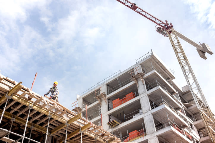 A crane next to a building under construction