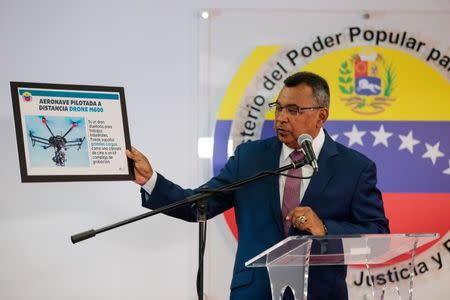 Venezuela's Interior and Justice Minister Nestor Reverol holds a placard with a picture of a drone during a news conference in Caracas, Venezuela August 5, 2018. Ministry of Interior and Justice/Handout via REUTERS