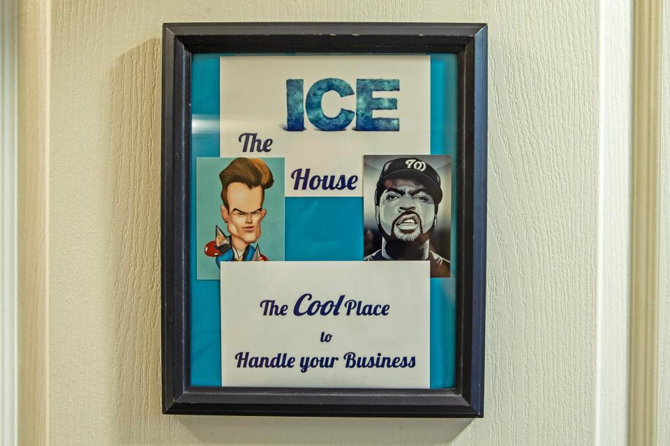 Images of Vanilla Ice and Ice Cube decorate the entrance sign to "The Ice House," the bathroom of the Hastings home in Magnolia, Monday, July 17, 2023. The bathroom is decorated with memorabilia from the rappers.