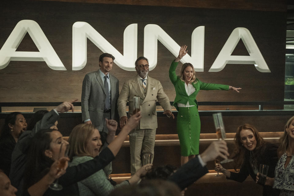 This image released by Netflix shows, from left, Chris Evans, Andy Garcia and Emily Blunt in a scene from "Pain Hustlers." (Betina La Plante/Netflix via AP)