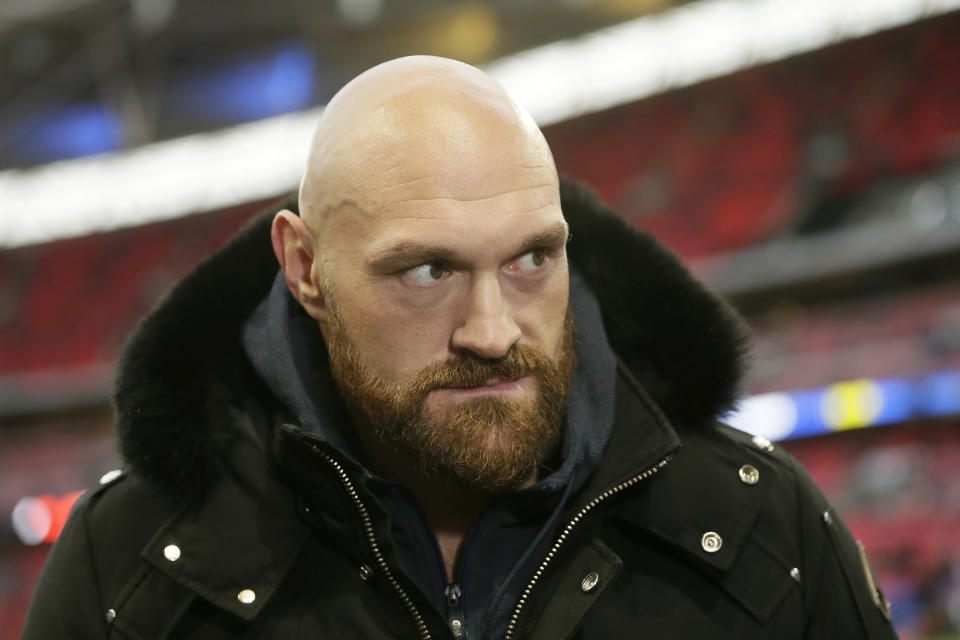 Boxer Tyson Fury is shown before an NFL football game between the Los Angeles Rams and the Cincinnati Bengals, Sunday, Oct. 27, 2019, at Wembley Stadium in London. (AP Photo/Tim Ireland)