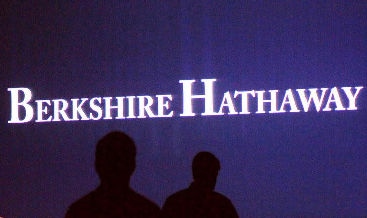 FILE PHOTO: Berkshire Hathaway shareholders walking by a video screen at the company's annual meeting in Omaha